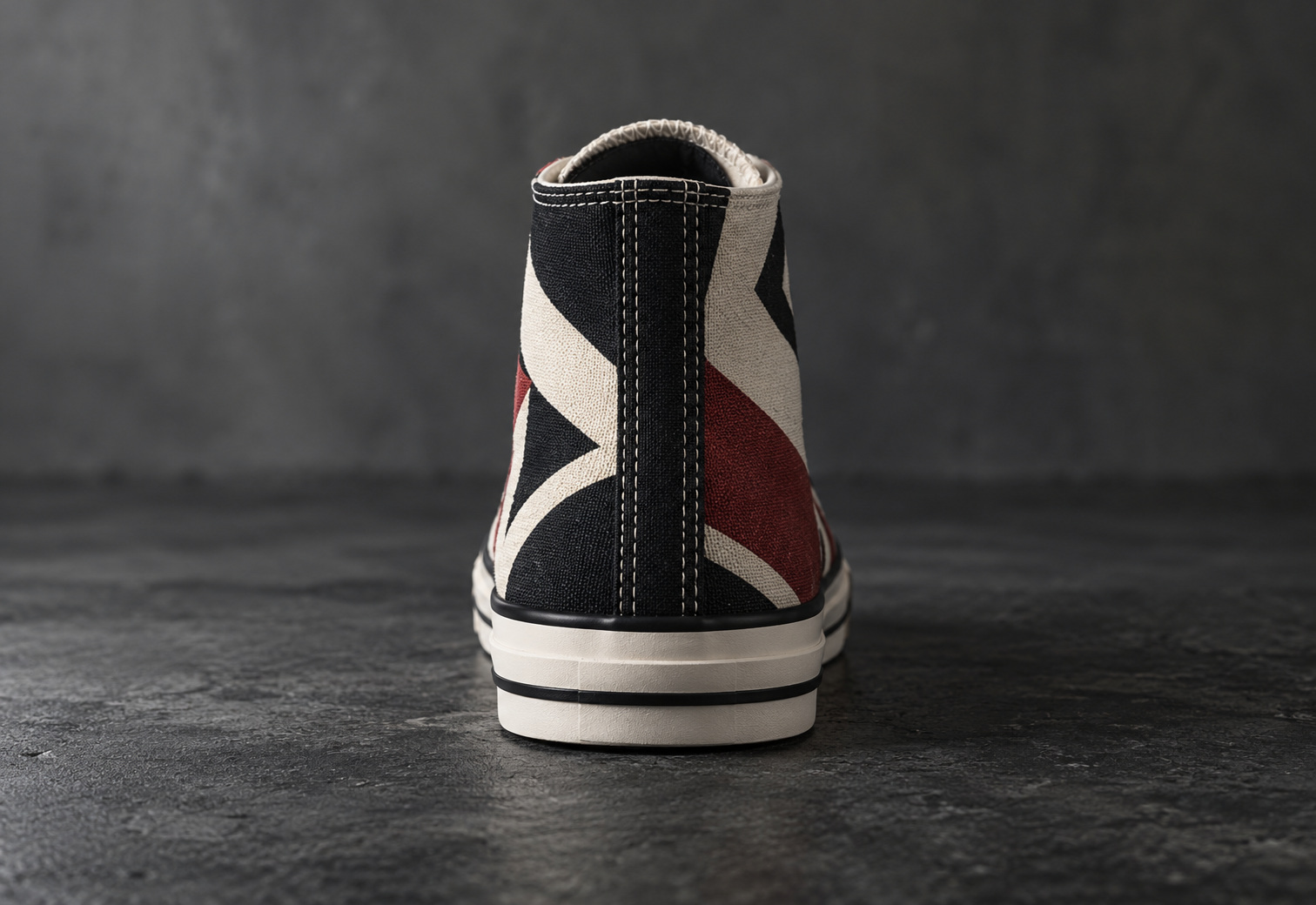 Close-up of a painted sneaker heel reading More Than A Shoe under a crown